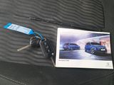 a picture of a picture of a car and a car key on the seat