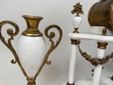 two vases sitting next to each other on a table
