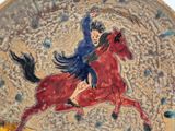 a painting of a woman riding a horse on a plate