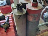 many fire hydrants sitting on a pallet in a room