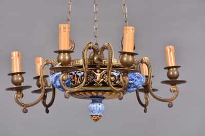 a chandelier that has a blue and gold design on it