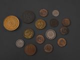 a lot of coins that are on the table