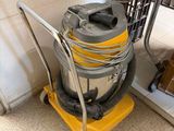 a vacuum that is sitting on a cart in the room
