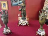 three vases sitting on a table with a red cloth