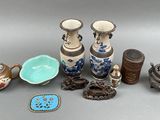 many different vases and bowls on the table