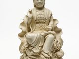 une image représentant une statue de Bouddha assis sur une vague