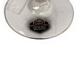a glass of wine with a label on it