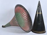 pair of black and green vases and a cone on a white background