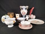 many different types of vases and plates on the table