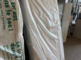 two mattresses that are sitting in a room