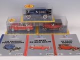 four different models of cars on display in a display case