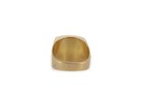a close up of a gold ring on a white background