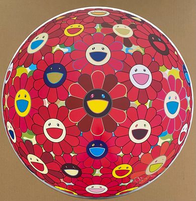 a large red flower ball with smiley faces on it