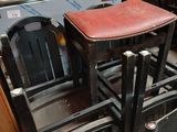 a stack of chairs and a stove in a room