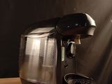 an image of a coffee maker on a wooden table