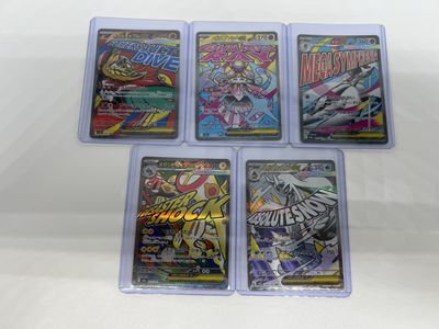 four different pokemon trading cards in plastic cases on a white surface