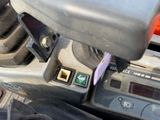 a close up of a car ' s dashboard with buttons and buttons