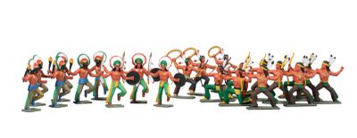 many figurines of different colors and sizes on a white surface