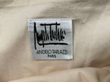 a close up of a white shirt with a black and white logo on it