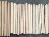 a lot of wooden sticks that are laying on the ground