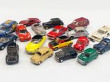 a lot of small toy cars on a white surface