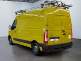 a yellow van that is parked in a garage