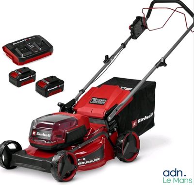 a close up of a lawn mower with a battery and batteries