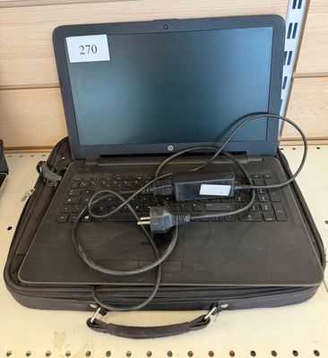 a laptop computer sitting on top of a black case