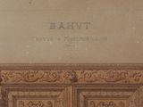 an old picture of a wooden cabinet with a sign above it