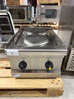 an image of a stove top sitting on top of a wooden pallet