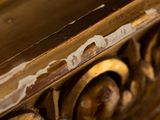 a close up of a wooden table with a clock on it