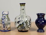 three vases sitting on a table next to each other
