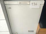 a broken refrigerator in the corner of a kitchen