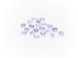 a pile of blue sapphires on a white background