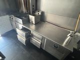 a large commercial kitchen with a lot of counter space