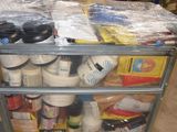 a cart with many items on it in a warehouse