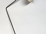 an image of a black and white lamp on a white surface