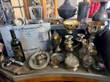 a table with a lot of silver items on it
