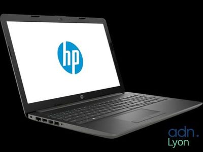 a laptop computer with a hp logo on the screen