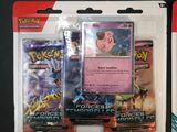 two packs of pokemon cards on display on a table