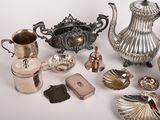 a lot of silver items that are on a table