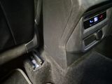 a close up of a car ' s dashboard with a remote control