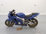 a blue motorcycle that is parked in a room