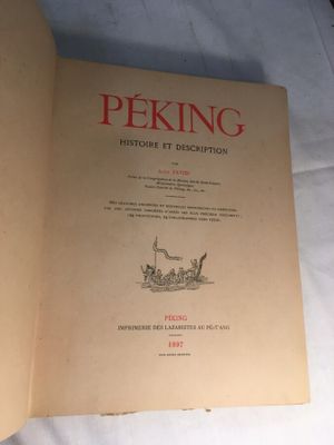 an open book with a drawing of a man on a horse drawn carriage
