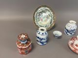 many different types of vases and bowls on the table