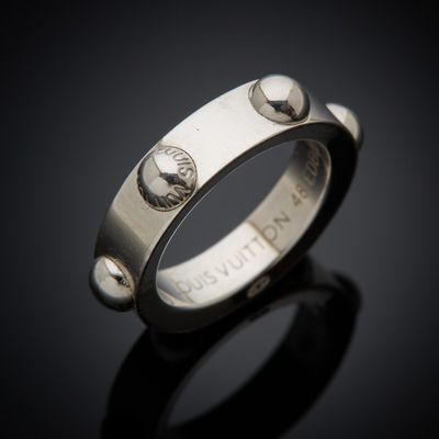 a close up of a ring on a black surface