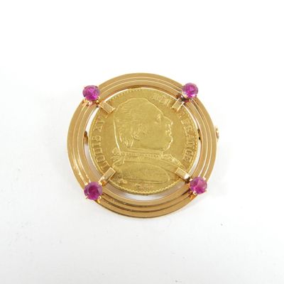 une image représentant une pièce d'or entourée d'une perle rose