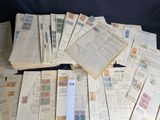 a lot of old letters and stamps on the table