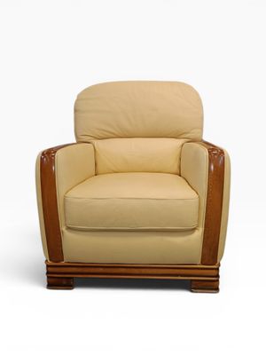 an upholstered chair with a wooden frame and beige upholstered seat