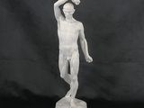 white marble statue of a man standing on a pedestal